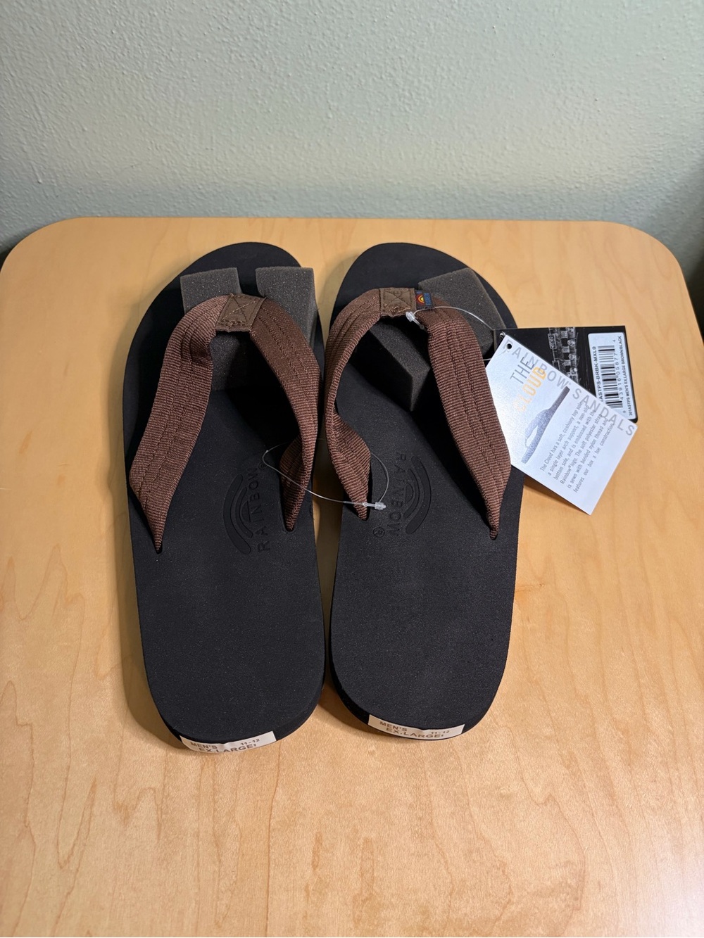 Rainbow Men's Brown Strap Black Footbed Flip Flops
